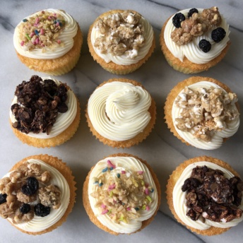 Gluten-free cupcakes topped with Safe + Fair granola