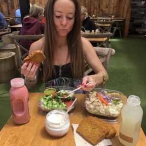 Jackie eating salad and carrot cake at Kreation