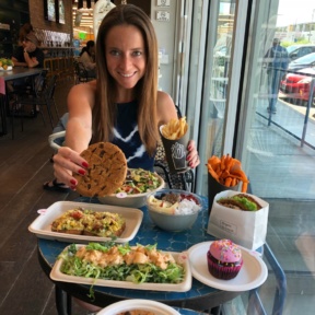 Jackie eating vegan food at By Chloe