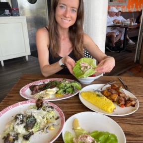 Jackie eating lobster lettuce wraps from Almond