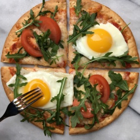 Gluten-free Cauliflower Cheese Pizza with eggs and tomatoes