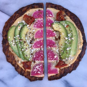 Sliced Cauliflower Pizza with Hummus, Watermelon Radish, Avocado, Feta