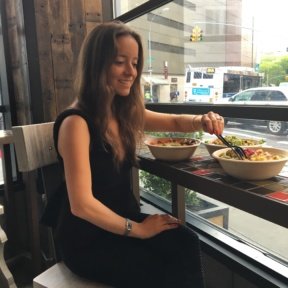 Jackie eating salad bowls at Sandwicherie