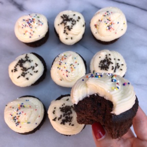 A bite of Chocolate Cupcakes with Buttercream Frosting