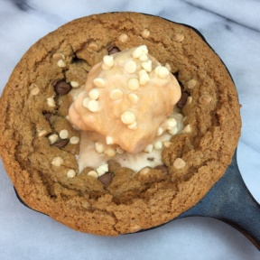 Gluten-free cookie skillet with white chocolate chips and ice cream