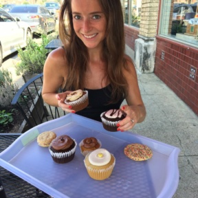Jackie eating gluten-free cupcakes at Unrefined Bakery