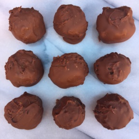 Nine Chocolate Covered Peanut Butter Balls