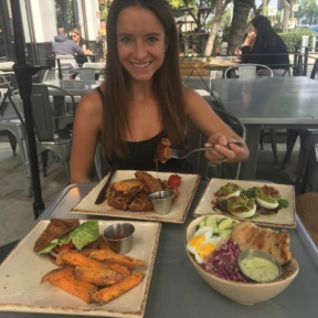 Jackie eating at Primal Kitchen Restaurant