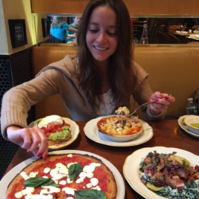 Jackie eating pizza and gnocchi from Nizza