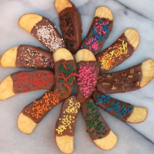 Chocolate Covered Apple Slices with sprinkles and nuts