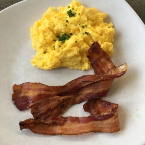 Scrambled eggs with bacon from Cheeky's