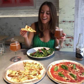 Jackie eating gluten-free pizza at Bruno Pizza