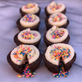 Eight gluten-free Sprinkle Filled Brownie Cupcakes