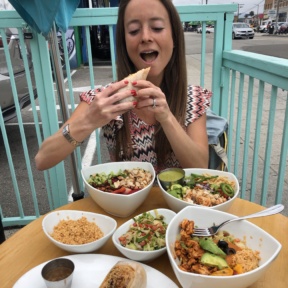 Jackie eating the gluten-free burrito at Tocaya