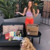 Jackie and Odie with Vitacost package