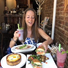 Jackie eating and drinking at Senza Gluten Cafe & Bakery