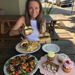 Jackie enjoying her bagel sandwich at New Cascadia