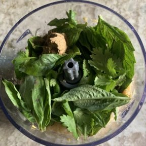 Making Baked Chickpea Falafel with basil and cilantro