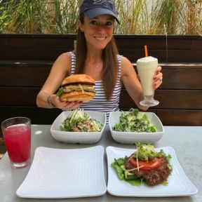 Jackie eating a gluten-free burger and shake at Burger Lounge