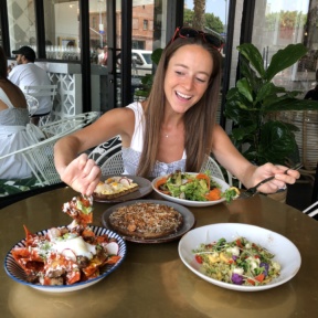 Jackie eating chilaquiles at The Gables