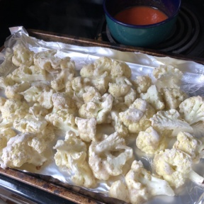 Ready to toss the cauliflower in hot sauce mixture