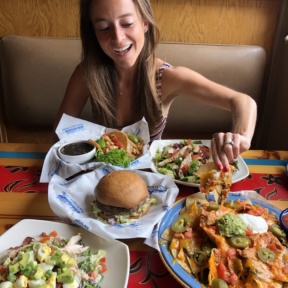 Jackie eating GF nachos at Islands