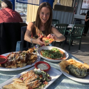 Jackie eating pizza at Tony P's Dockside Grill