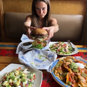 Jackie eating a gluten-free burger at Islands