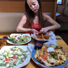 Jackie eating fries at Islands Restaurants