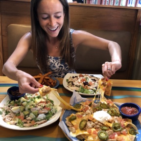 Jackie eating nachos at Islands Restaurants