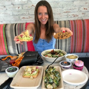 Jackie eating avocado toast and cookies at By Chloe