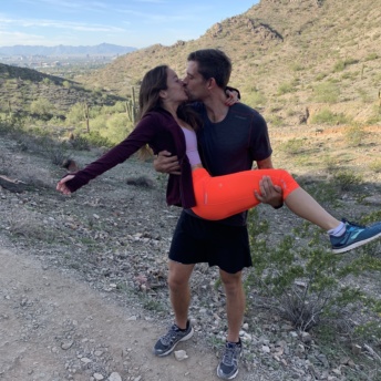 Jackie and Brendan kissing on hike in Phoenix