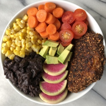 Black bean crusted cod with veggies in a bowl
