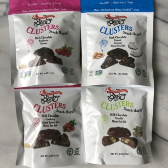 Four bags of chocolate clusters by Bixby & Co