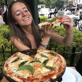 Jackie eating gluten-free pizza at Rocco & Simona