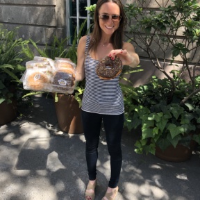 Jackie eating gluten-free donuts from Pan Gabriel