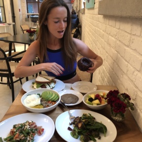 Jackie ready to eat gluten-free bundt cake at Nourish