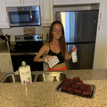 Jackie cleaning with Home Made Simple after making brownies