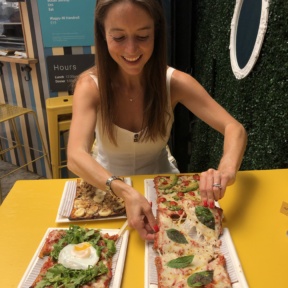 Jackie eating pizza at Cheska's