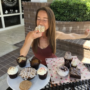 Jackie eating a donut at Karma Baker