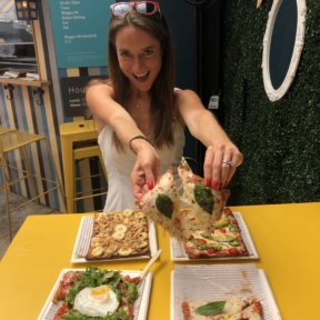 Jackie eating cauliflower crust pizza at Cheska's