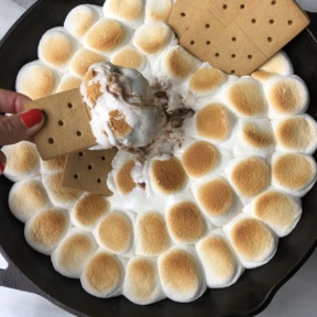 Jackie digging into Peanut Butter Cup S'mores Skillet Dip