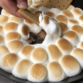 Digging into Peanut Butter Cup S'mores Skillet Dip