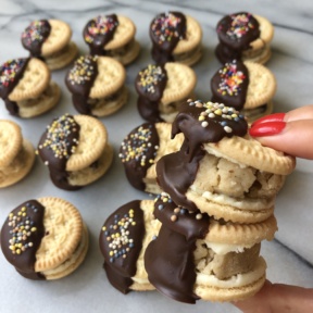 Stack of Chocolate Dipped Cookie Dough Stuffed Creme Cookies