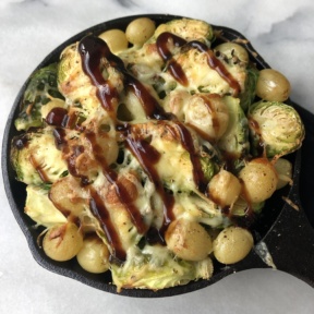 Roasted Brussels Sprouts with Grapes, Cheddar, and Balsamic Glaze