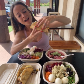 Jackie eating GF tacos at Papaya's Natural Foods