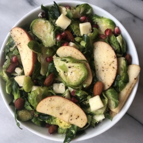 Gluten-free Shredded Brussels Sprouts and Apple Salad with cheddar