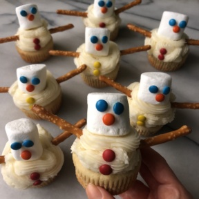 Gluten-free Snowman Cupcakes with pretzel sticks