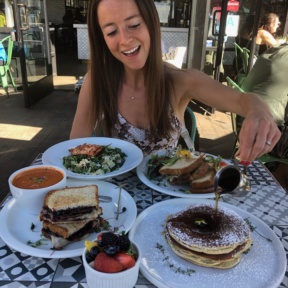 Jackie eating pancakes at Society Kitchen