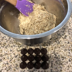 Making Chocolate Stuffed Snowball Cookies